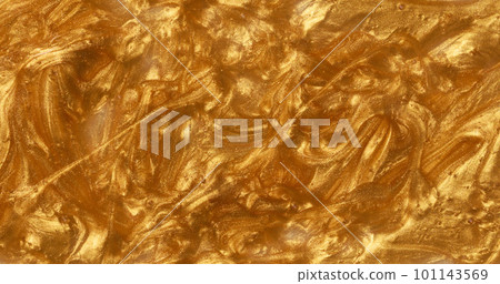 Sample of golden glitter gel with small particles, texture of highlighter cosmetics Sample of golden glitter gel with small particles, texture of highlighter cosmetics 101143569