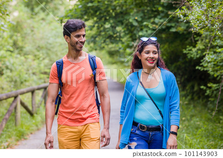 Senda del oso, Teverga Asturias. mixed race travelers couple hiking ecotourism conservation path Senda del oso, Teverga Asturias. mixed race travelers couple hiking ecotourism conservation path 101143903
