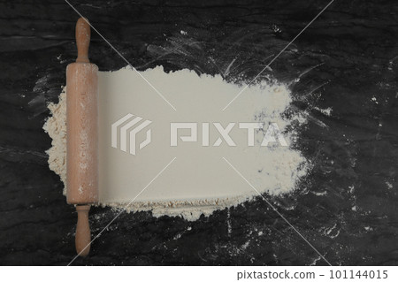 Flour and rolling pin on grey marble table, flat lay with space for text Flour and rolling pin on grey marble table, flat lay with space for text 101144015