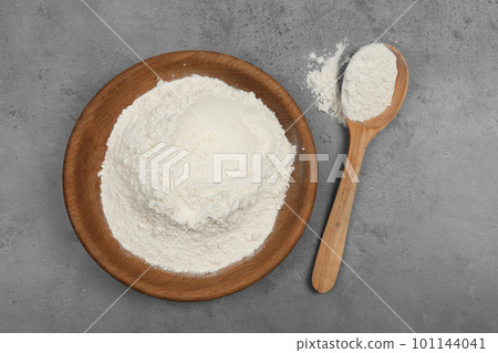 Flour on light grey background, flat lay Flour on light grey background, flat lay 101144041