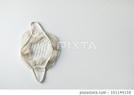 Empty net bag on white background, top view. Space for text 101144139
