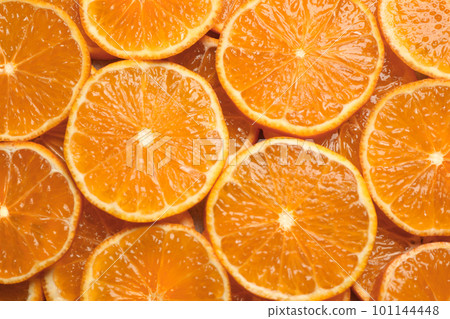 Slices of fresh ripe tangerines as background, top view. Citrus fruit Slices of fresh ripe tangerines as background, top view. Citrus fruit 101144448