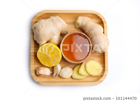 Fresh garlic and other natural cold remedies isolated on white, top view Fresh garlic and other natural cold remedies isolated on white, top view 101144470