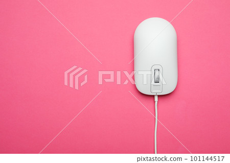 Wired computer mouse on pink background, top view. Space for text 101144517
