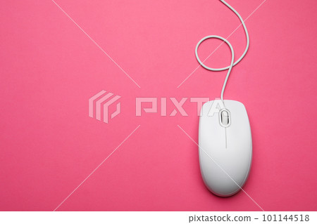 Wired computer mouse on pink background, top view. Space for text 101144518