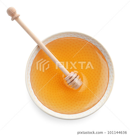 Bowl of organic honey and dipper isolated on white, top view 101144636