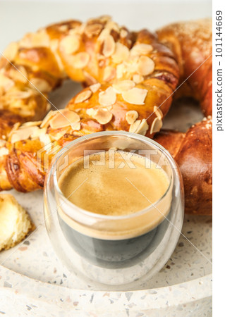 Fresh tasty pastries and coffee on tray, closeup Fresh tasty pastries and coffee on tray, closeup 101144669
