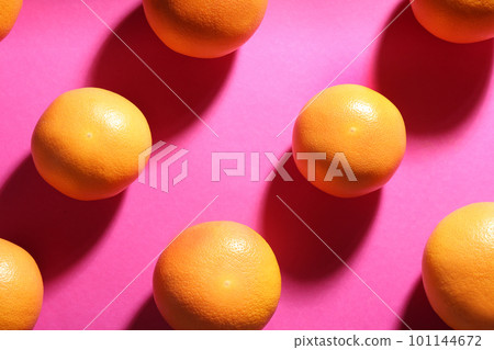 Tasty ripe grapefruits on magenta background, flat lay 101144672
