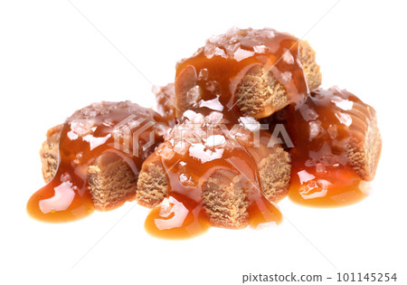 Delicious salted caramel with sauce on white background 101145254
