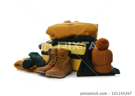 Suitcase with warm clothes isolated on white. Winter vacation Suitcase with warm clothes isolated on white. Winter vacation 101145267