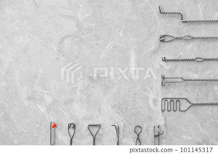 Set of different logopedic probes and space for text on marble table, flat lay. Speech therapist's tools Set of different logopedic probes and space for text on marble table, flat lay. Speech therapist's tools 101145317