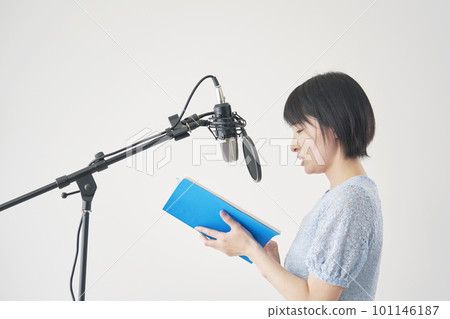 Female voice actor dubbing in the studio 101146187