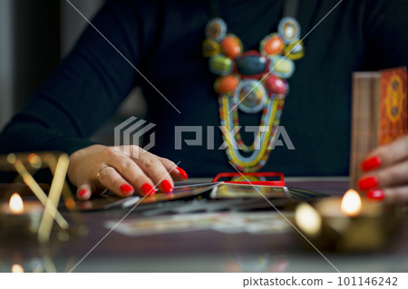 Tarot reader or fortune teller holding tarot cards Tarot reader or fortune teller holding tarot cards 101146242