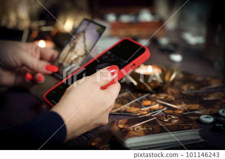 Blurred tarot cards on the table, esoteric concept, fortune telling predictions Blurred tarot cards on the table, esoteric concept, fortune telling predictions 101146243