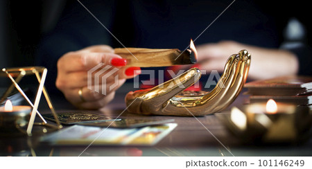 Blurred tarot cards on the table, esoteric concept, fortune telling predictions 101146249