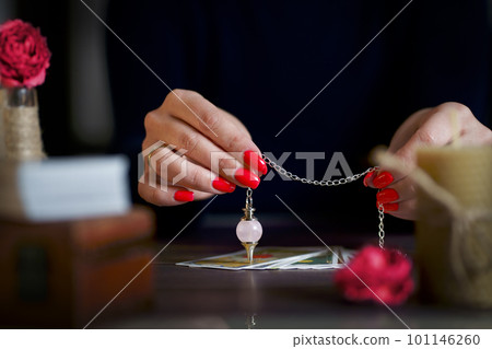 Blurred tarot cards on the table, esoteric concept, fortune telling predictions 101146260