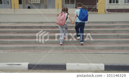 child students cross road zebra crossing. friends classmates pass car pedestrian crossing sign. give way child sign. boy girl with school backpacks run school by hand. brother sister child with city 101146320