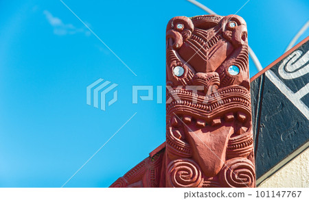 The Maori art carving decoration in Whakarewarewa the living Maori village in geothermal area of Rotorua, New Zealand. The Maori art carving decoration in Whakarewarewa the living Maori village in geothermal area of Rotorua, New Zealand. 101147767