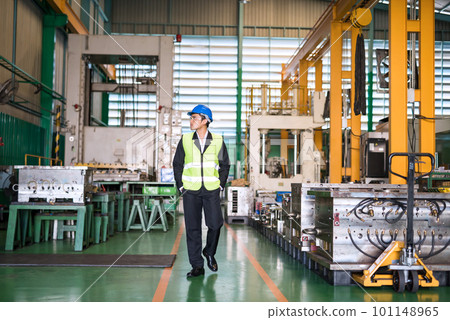 Waist up manager walk to examine machine in factory Waist up manager walk to examine machine in factory 101148965