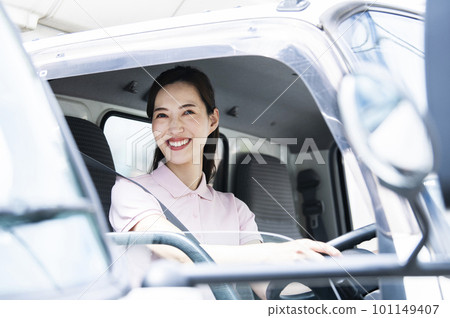 Woman driving a truck Woman driving a truck 101149407