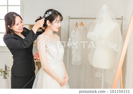 A bride and a wedding planner woman meeting for a wedding, wedding hairstyle, hairstyle A bride and a wedding planner woman meeting for a wedding, wedding hairstyle, hairstyle 101150151