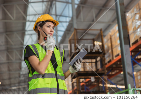 portrait working woman staff worker inventory management supervisor team work operate warehouse products shipping control job. 101150264