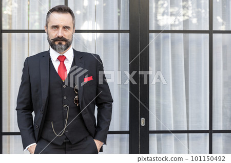 Portrait hispanic latin moustache gentlemen fashion stylish dressing tuxedo jacket suit smart handsome model. Business man boss lawyer latino standing. 101150492