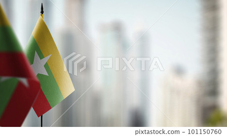 Small flags of the Myanmar on an abstract blurry background Small flags of the Myanmar on an abstract blurry background 101150760