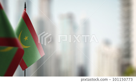 Small flags of the Mauritania on an abstract blurry background Small flags of the Mauritania on an abstract blurry background 101150773