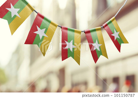 A garland of Myanmar national flags on an abstract blurred background A garland of Myanmar national flags on an abstract blurred background 101150787
