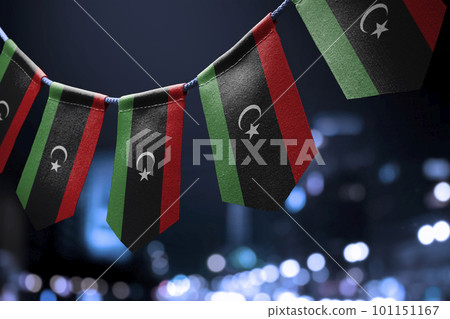 A garland of Libya national flags on an abstract blurred background 101151167