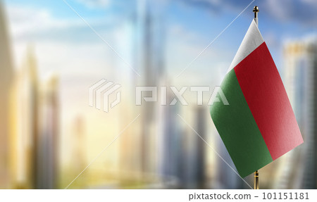 A small Madagascar flag on an abstract blurry background A small Madagascar flag on an abstract blurry background 101151181