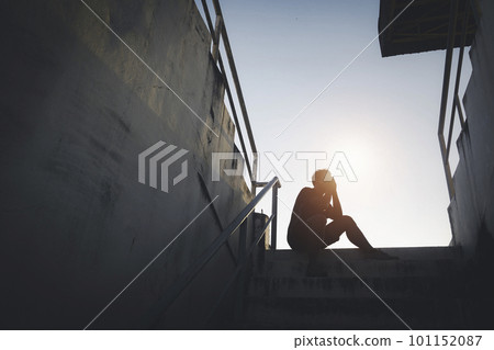 Silhouetted of sad photo. Lonely man sitting on the floor.He is unhappy and sad.He is depression.unlove,unhappy,fail.Photo concept for Disease and depression. Silhouetted of sad photo. Lonely man sitting on the floor.He is unhappy and sad.He is depression.unlove,unhappy,fail.Photo concept for Disease and depression. 101152087
