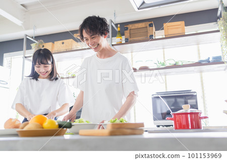 young couple cooking together 101153969