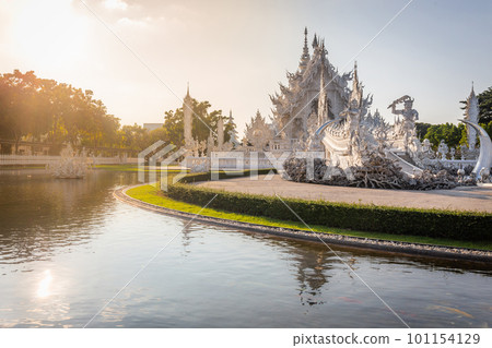 Beautiful and amazing white temple at Wat Rong Khun at sunset time Chiang Rai, Thailand It is a tourist destination. Landmark of Chiang Rai 101154129