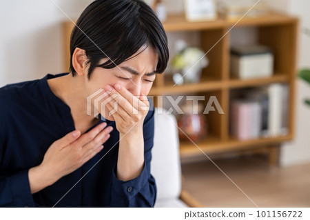 young woman feeling nauseous 101156722