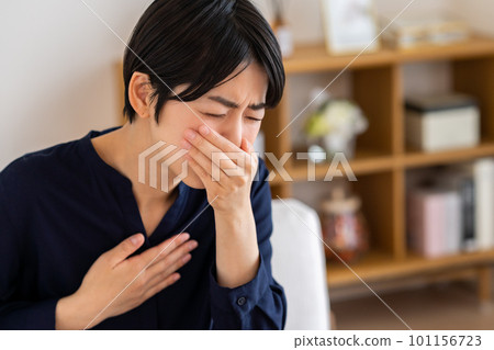 young woman feeling nauseous 101156723