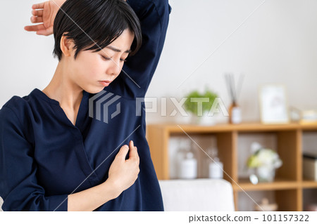 young woman touching her chest 101157322