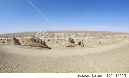 Aerial view of landscape in desert under blue sky 101159315