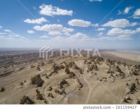 Aerial view of landscape in desert under blue sky 101159427