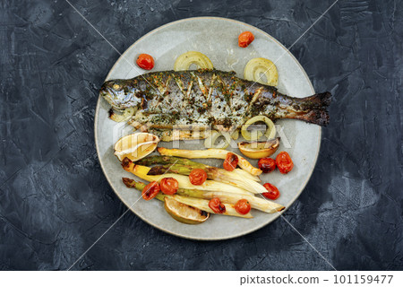 Trout fried with white asparagus 101159477