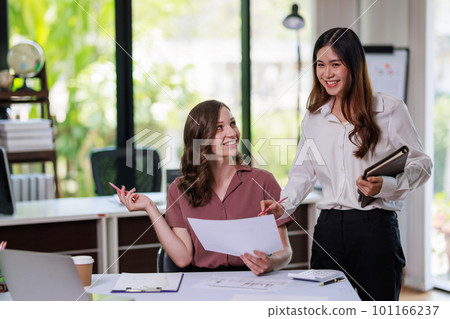 Concept of business office woman working, Businesswoman working with investment plan with her partner and analyzing document business investment graph data by using calculator and laptop Concept of business office woman working, Businesswoman working with investment plan with her partner and analyzing document business investment graph data by using calculator and laptop 101166237