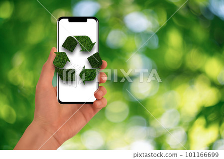 Man is holding a phone with green recycling symbol. Concept Man is holding a phone with green recycling symbol. Concept 101166699