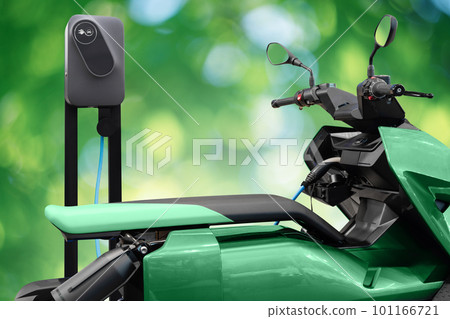 Electric scooter with charging station on a green background Electric scooter with charging station on a green background 101166721