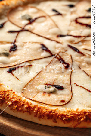 Gourmet pizza with pear and gorgonzola cheese 101167414
