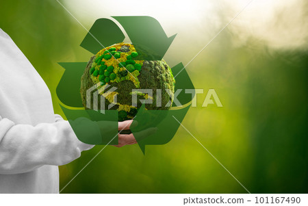 Woman holding a green planet Earth Woman holding a green planet Earth 101167490