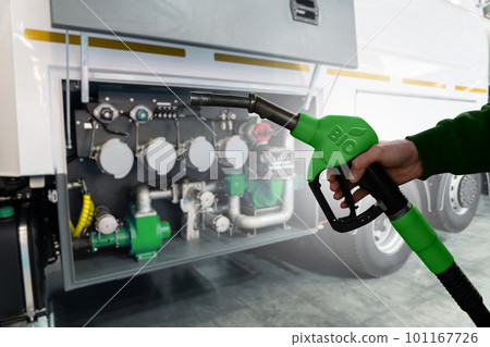 Hand with fuel nozzle with inscription BIO. Hand with fuel nozzle with inscription BIO. 101167726
