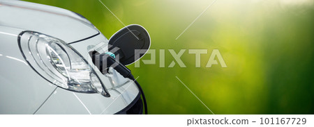 Close up of electric car inlet with a connected charging cable Close up of electric car inlet with a connected charging cable 101167729