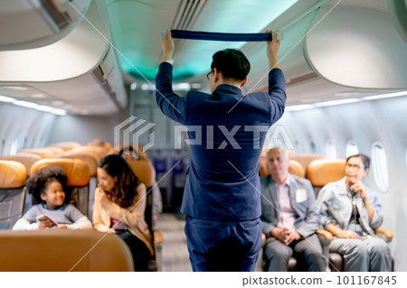 Airline staff man demonstration and explain about safety tools, safety belt, in the airplane 101167845