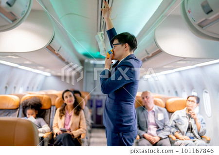 Airline staff man demonstration and explain about safety tools, oxygen mask, in the airplane 101167846